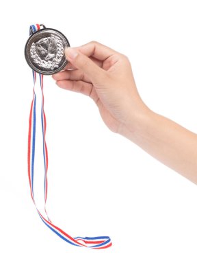 Winner hand raised and holding silver award medal with ribbon is