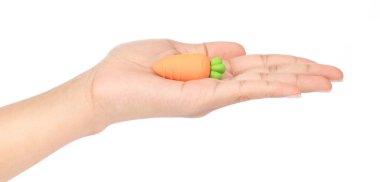 hand holding carrot of rubber erasers isolated on white backgrou