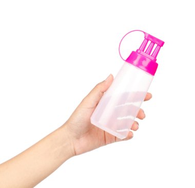 El sıkışma şişesi. Üç baharat başlığı izole edilmiş. 