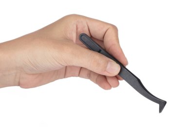 Hand holding black anti-static tweezers isolated on white backgr