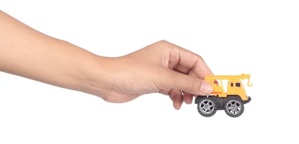 Mão segurando brinquedo carro isolado no fundo branco — Fotografia de Stock