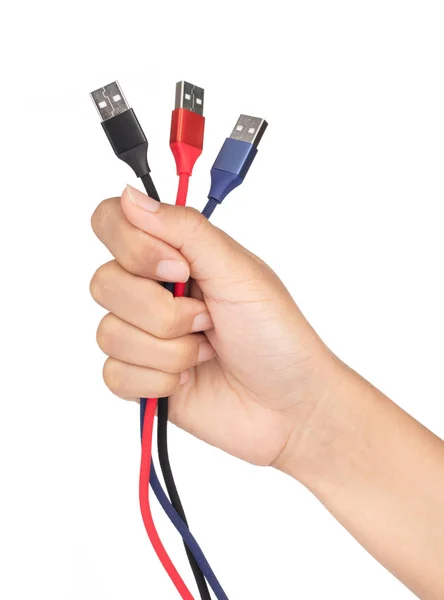 Hand holding set of USB cable for smartphone isolated on white b — 스톡 사진