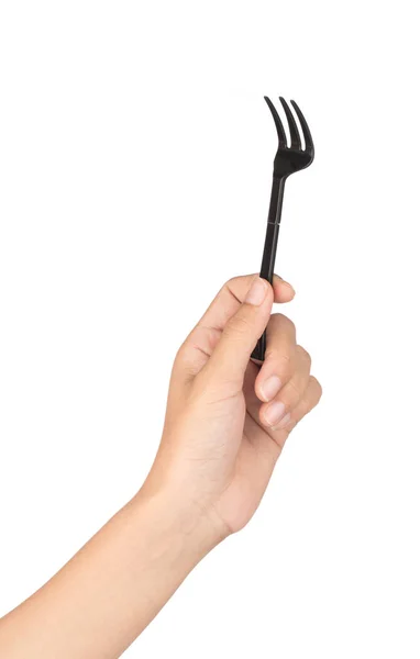 Hand holding Zwart van vork geïsoleerd op witte achtergrond. — Stockfoto