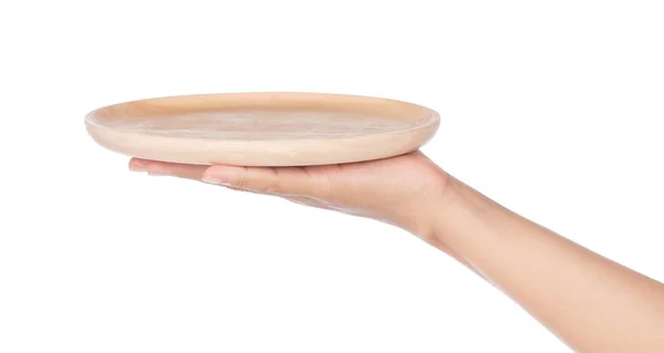 Trzymanie ręki Pusty drewniany talerz izolowany na białym tle — Zdjęcie stockowe