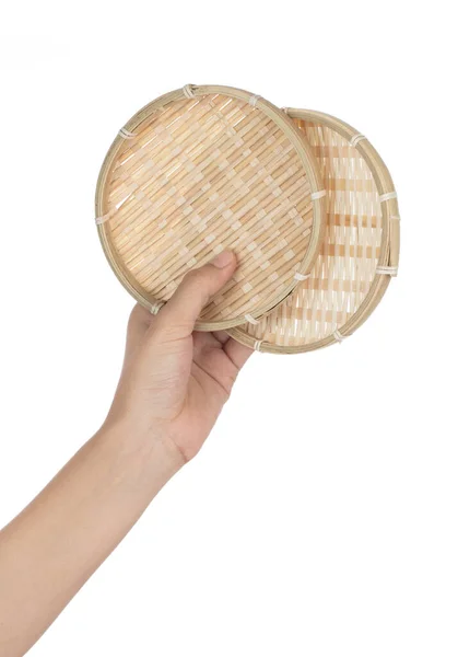 Hand holding bamboo winnowing trays isolated on a white backgrou — 스톡 사진