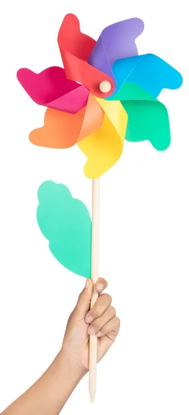Hand holding Colored pinwheel Isolated on White background — Stock Photo, Image
