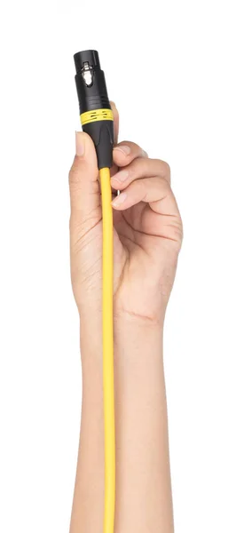 Ręczne trzymanie Żółty kabel mikrofonowy Xlr izolowany na białej ba — Zdjęcie stockowe