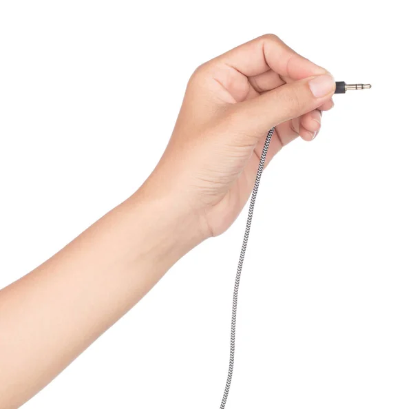 Mão segurando cabo de áudio isolado no fundo branco . — Fotografia de Stock