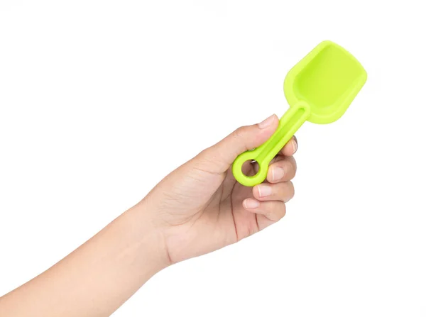 手を保持白い背もたれに隔離された小さなプラスチック製のおもちゃのシャベル — ストック写真