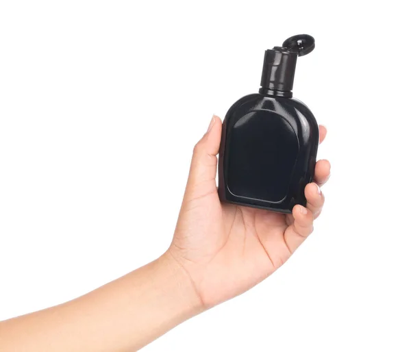Mão segurando garrafa cera proteção do produto para carro e couro i — Fotografia de Stock