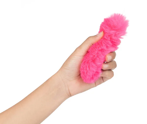 Hand holding Pink of fur tassel tail isolated on a white backgro — Stok fotoğraf