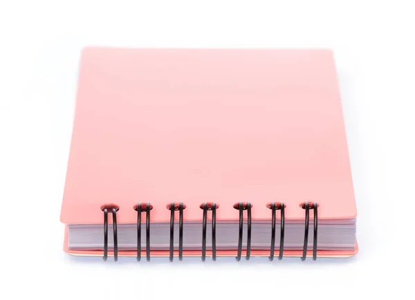 Livro de notas rosa isolado em um fundo branco — Fotografia de Stock