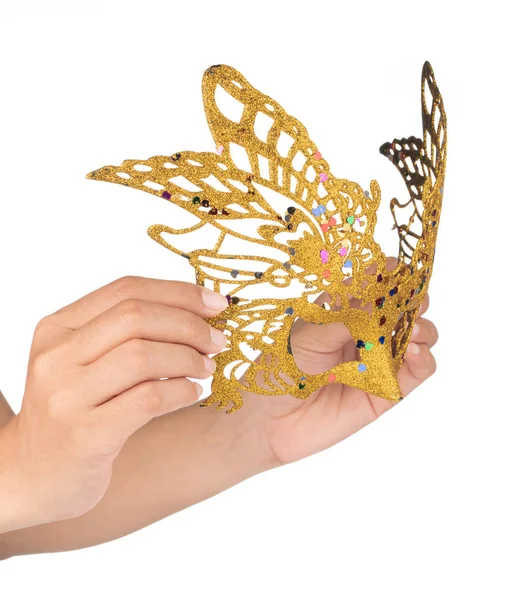 Hand holding gold carnival mask with glitter isolated on white b — 图库照片