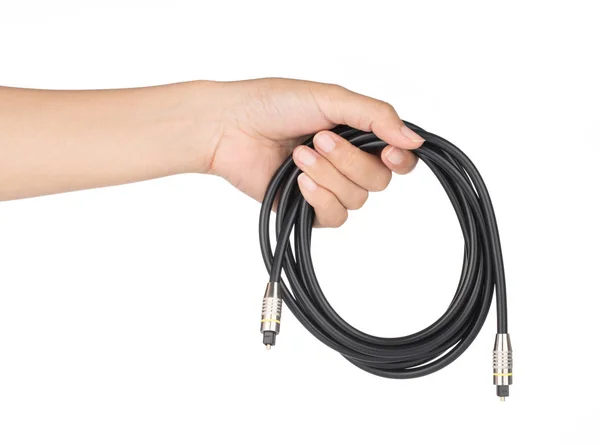 Mão segurando cabo de áudio óptico isolado no fundo branco . — Fotografia de Stock