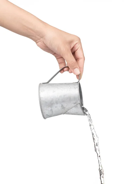 Ręka trzymając mały metalowy kanister nawadniania z wylewki izolowane na w — Zdjęcie stockowe