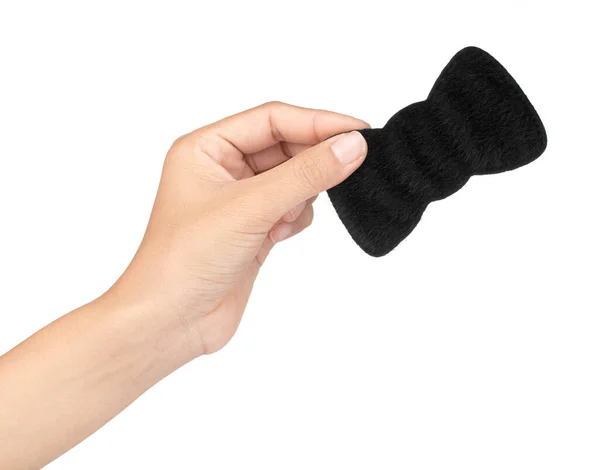 Hand holding Black bow isolated on white background. — Stock Photo, Image