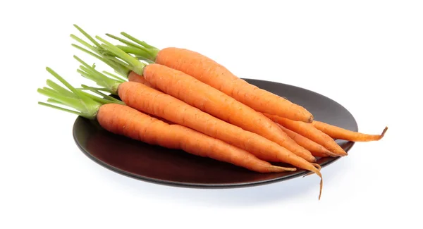 Fresh baby carrots on dish isolated on white background — ストック写真