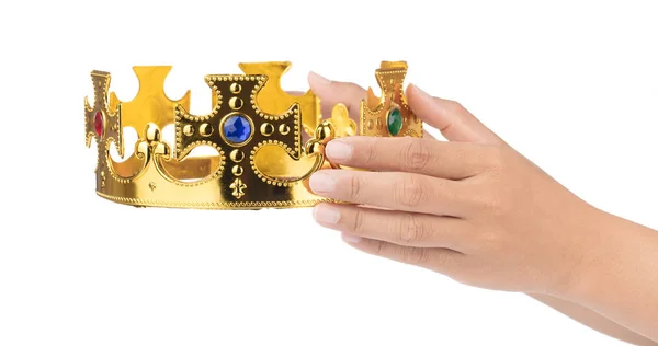Main tenant couronne dorée isolée sur un fond blanc — Photo