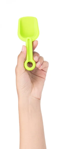 Hand hält kleine Plastikschaufel isoliert auf weißem Backgr — Stockfoto
