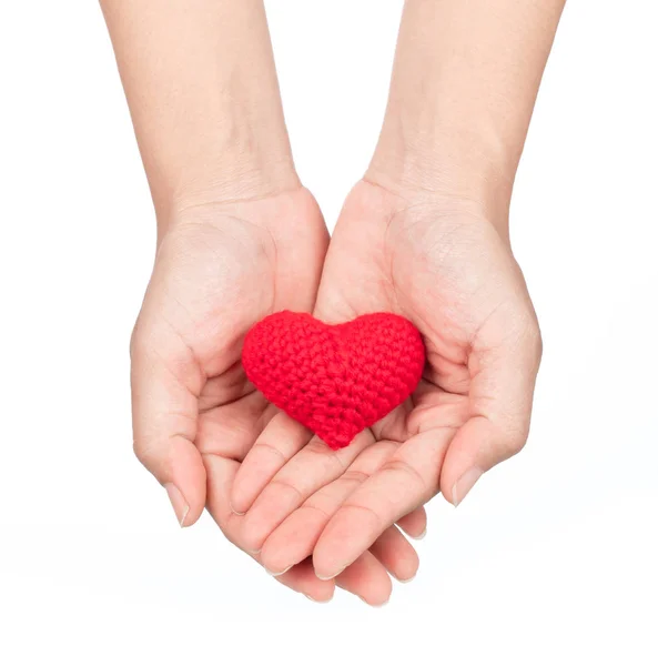 Hands holding red crocheted heart isolated on white background — Stok fotoğraf