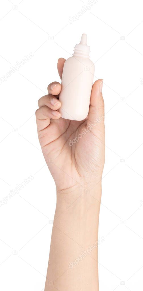 hand holding makeup liquid foundation isolated on white backgrou