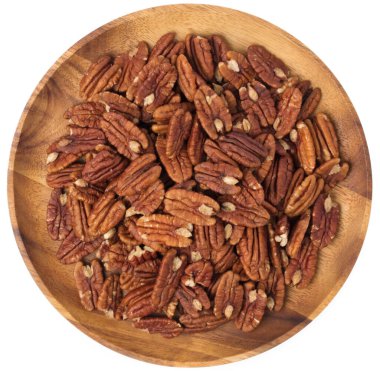 wood dish of pecan nuts isolated on white background