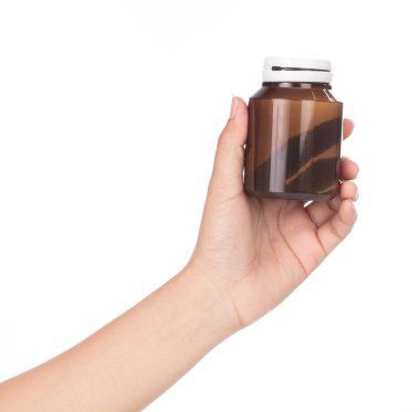 hand holding Brown Drug Bottle isolated on white background