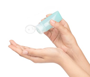 hand holding small plastic bottle of hygiene products  isolated 