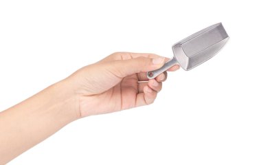 hand holding silver scoop isolated on white background
