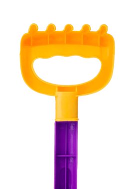 Rake of plastic toy isolated on a white background.
