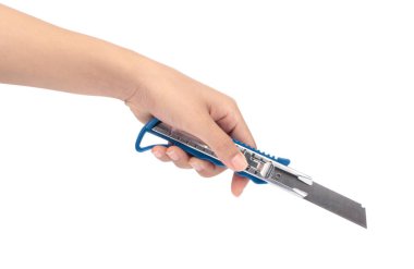 hand holding Blue cutter knife isolated on white background