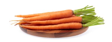fresh baby carrots on wood dish isolated on white background