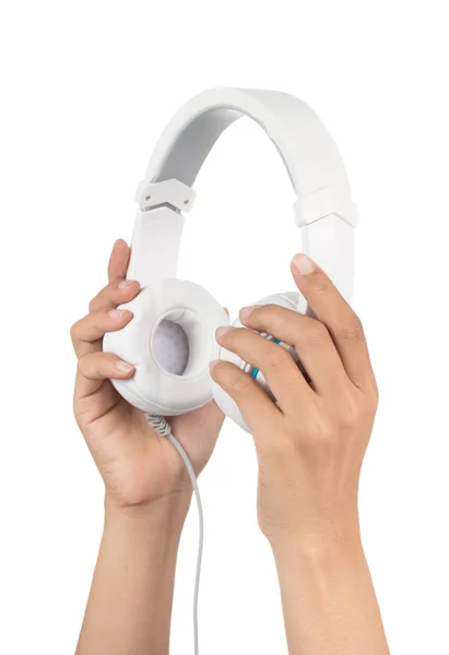 Mano sosteniendo auriculares blancos aislados sobre fondo blanco — Foto de Stock