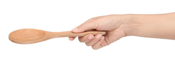 Mão segurando colher de madeira isolada no fundo branco — Fotografia de Stock