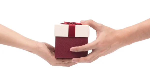 Woman's hand giving gift box to man isolated on white background — Stock Photo, Image