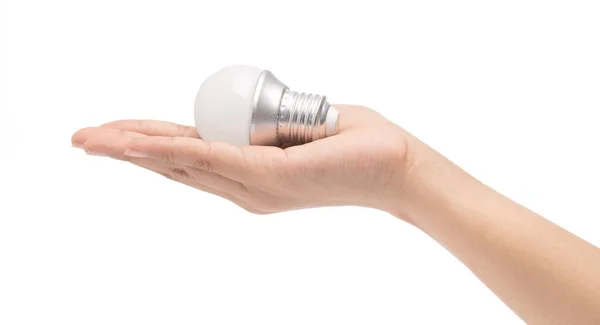 Mano con una lampadina incandescente isolata su fondo bianco . — Foto Stock