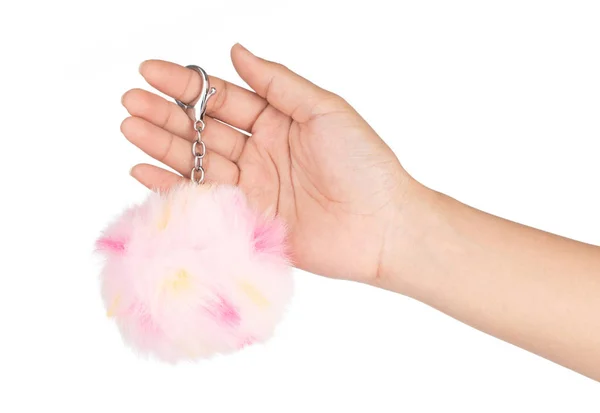Hand holding Fur ball of key chain with rings isolated on white — 스톡 사진