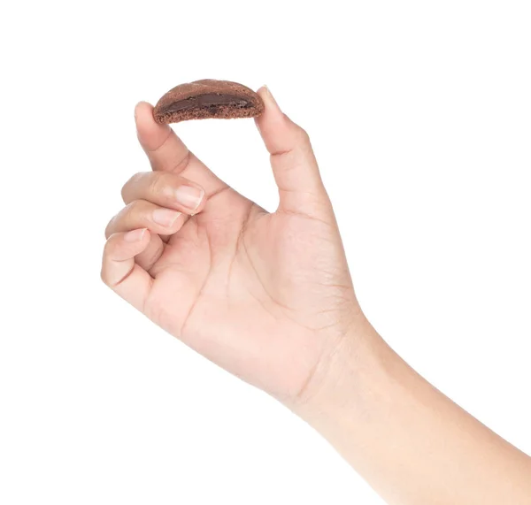 Χέρι κρατώντας σοκολάτα μπισκότο απομονώνονται σε λευκό φόντο — Φωτογραφία Αρχείου