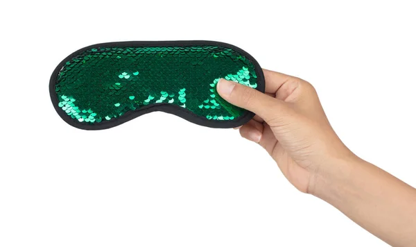 Hand holding Green sleeping eye mask with sequins that look like — 图库照片