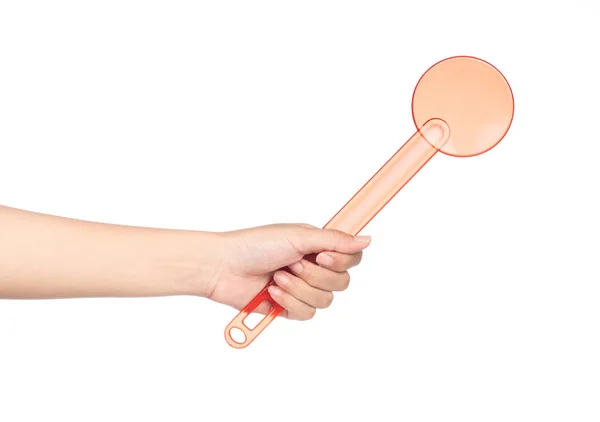 Hand holding plastic kitchen utensils isolated on a white backgr — 图库照片