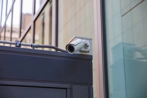 security camera on metal beam of modern office building