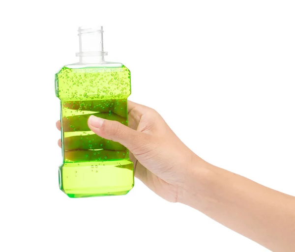 Hand holding Mouthwash in plastic bottle isolated on white backg — Stok fotoğraf
