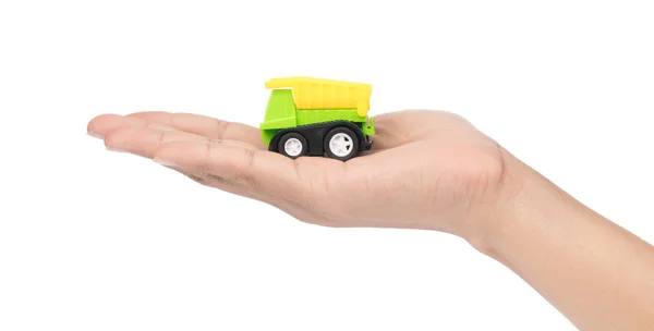 Mão segurando caminhão de lixo brinquedo isolado no fundo branco — Fotografia de Stock