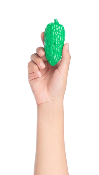 Ruční držení plastová hračka tykev izolované na bílém pozadí — Stock fotografie