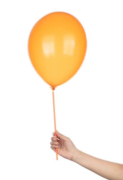 Mão segurando Balão de borracha laranja isolado em um backgroun branco — Fotografia de Stock