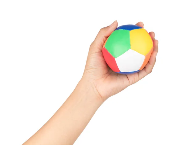 Mão segurando bola brinquedo isolado no fundo branco — Fotografia de Stock