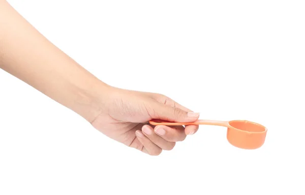 Mână ţinând portocaliu plastic scoop izolat pe fundal alb — Fotografie, imagine de stoc