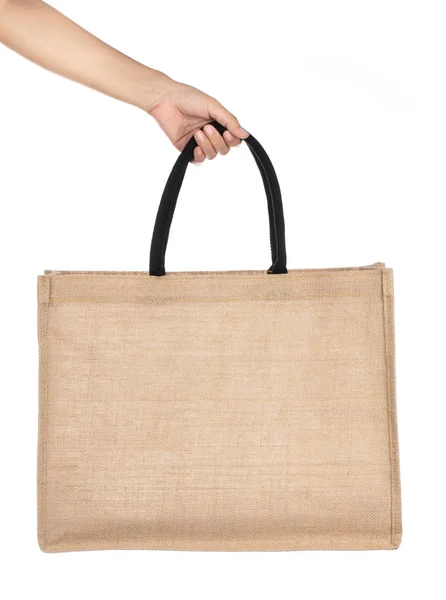 Рука холдинг сумки Мода Конопля сумки изолированы на белом б — стоковое фото