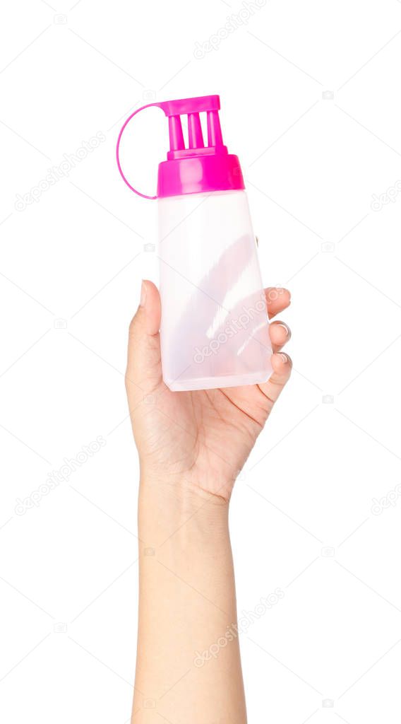 hand holding squeeze bottle three head of condiment isolated on 