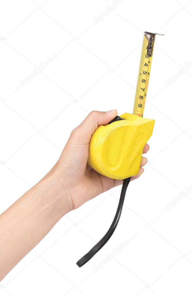 Hand holding Yellow tape measure isolated on white background